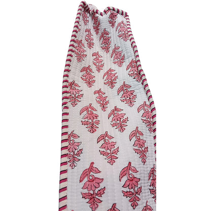 Floral patterned fabric with red and white design on a white background