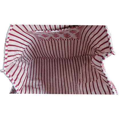 Red and white striped fabric with ruffled edges on a white background