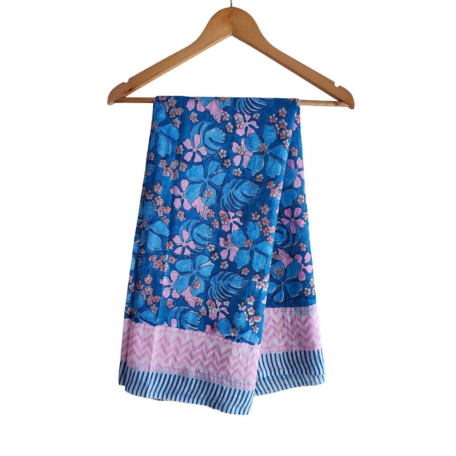 Blue and pink floral patterned towel on a wooden hanger against a white background