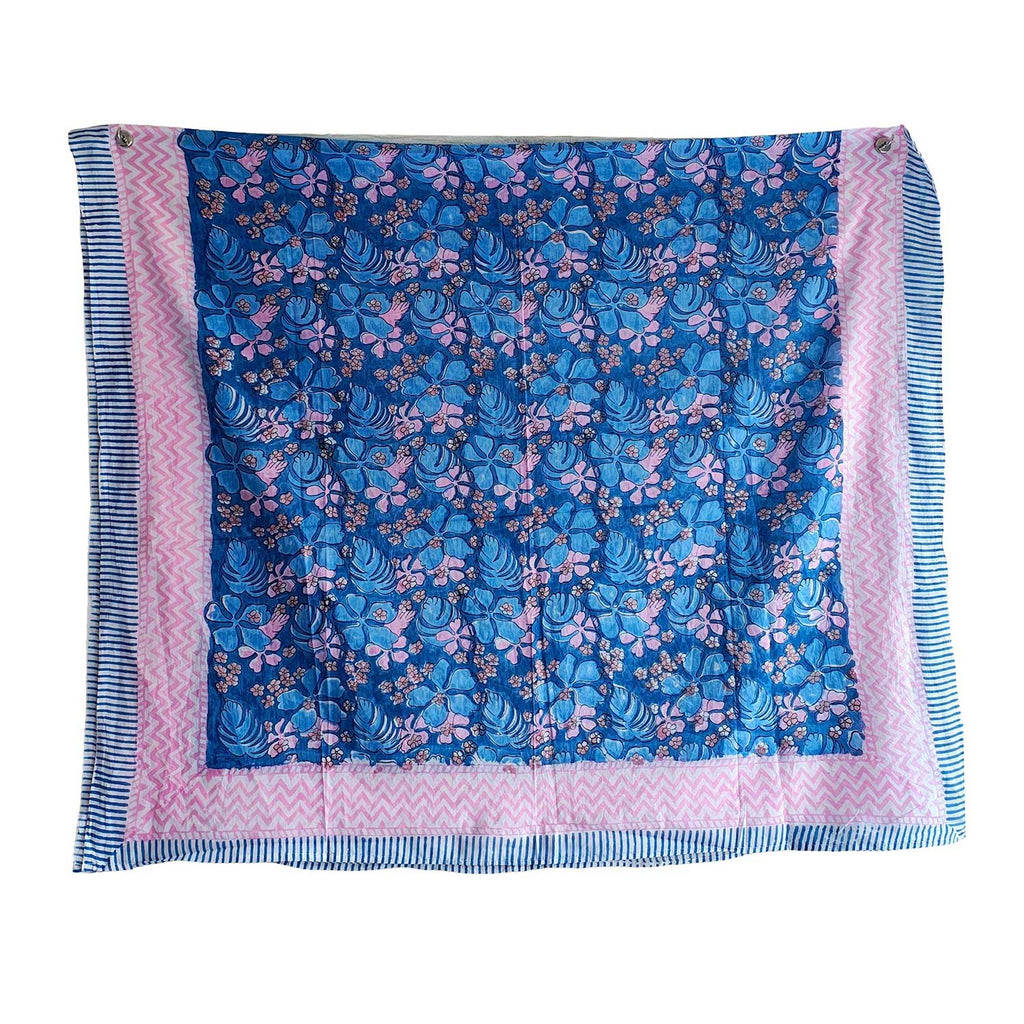 Floral patterned fabric with blue and pink colors on a white background