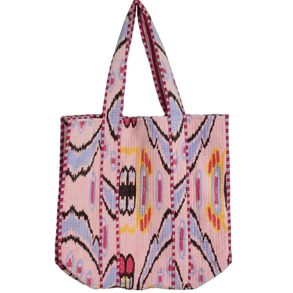Pink patterned bag with a strap on a white background
