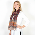 Woman wearing a patterned scarf on a white background