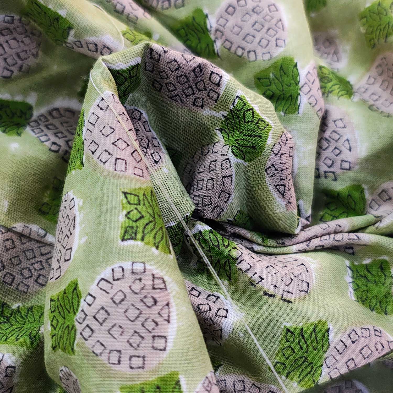 Close-up of green fabric with patterned design