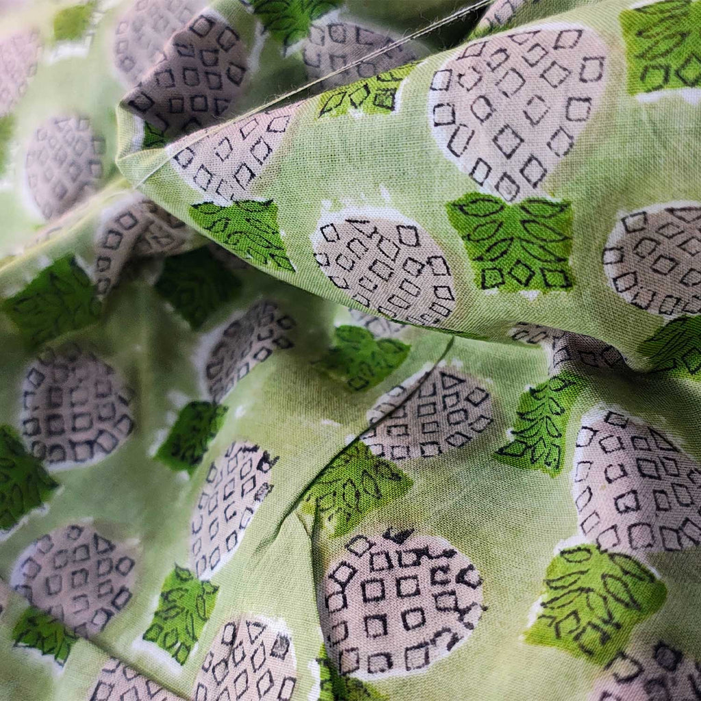 Close-up of green fabric with pineapple pattern