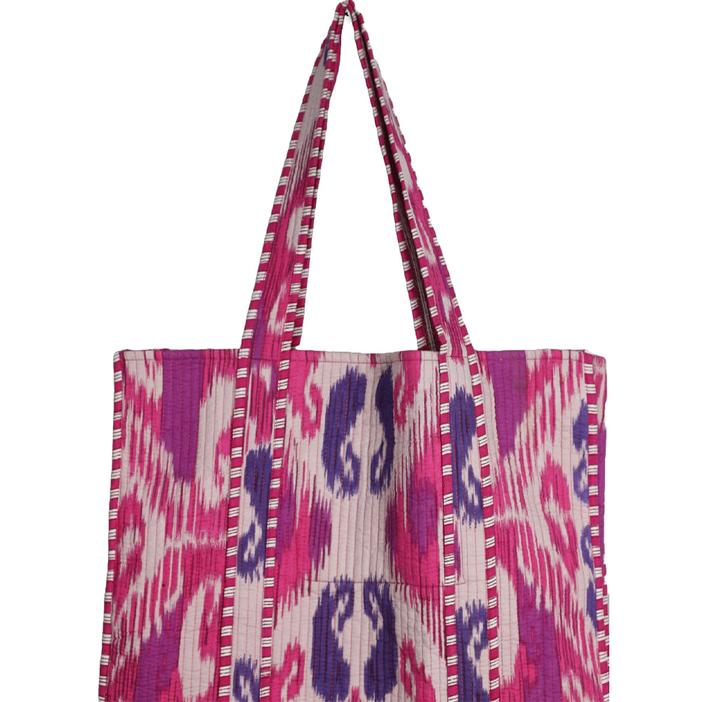 Tote bag with pink and purple abstract pattern on a white background