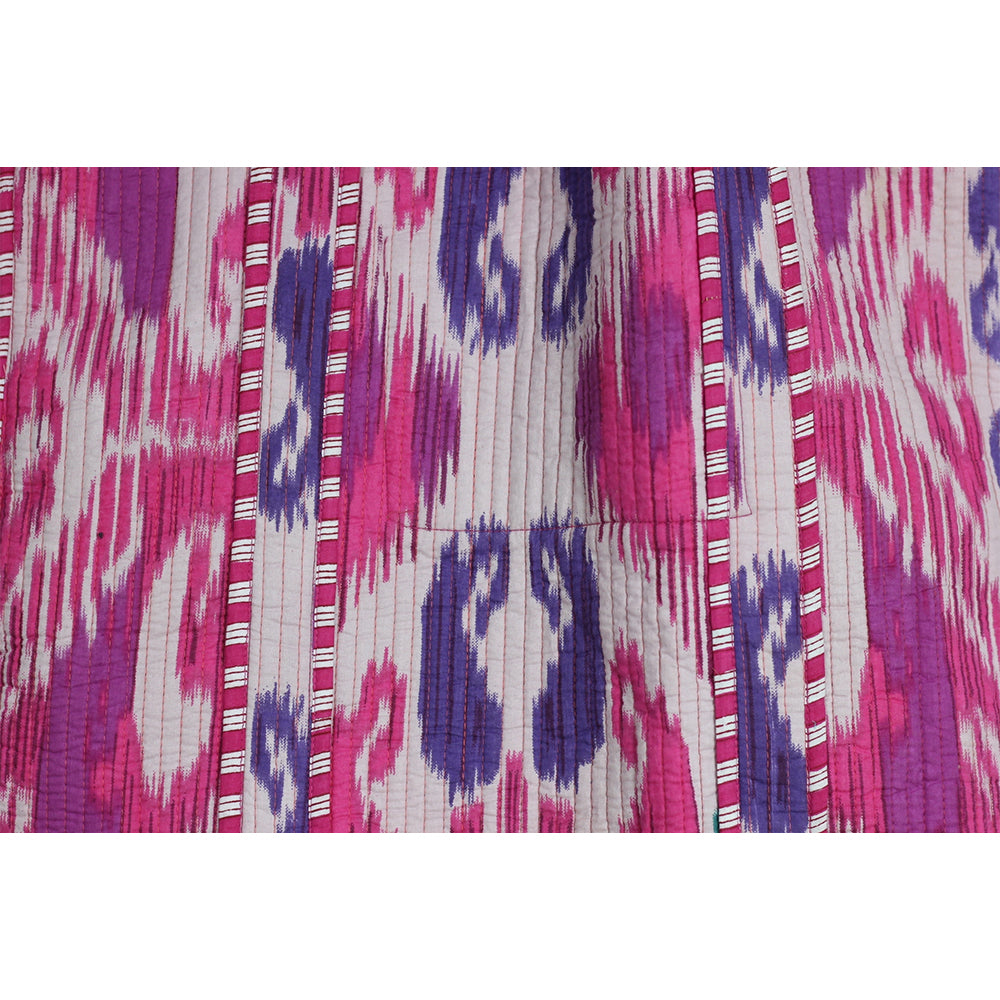 Close-up of fabric with pink, purple, and white pattern