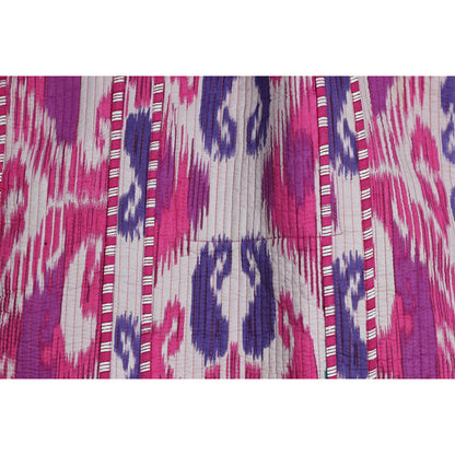 Close-up of fabric with pink, purple, and white pattern
