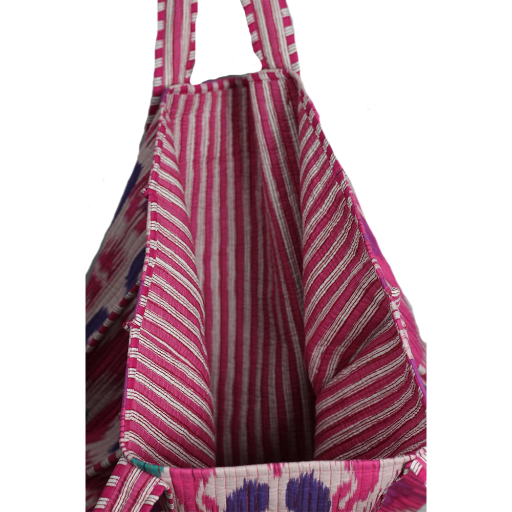 Striped bag with pink and white pattern on a white background