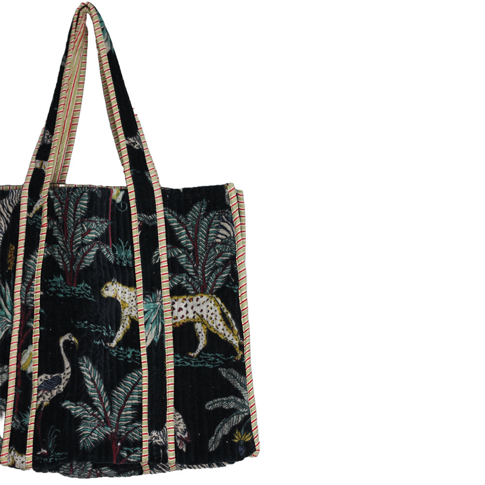 Floral-patterned bag with a strap on a white background