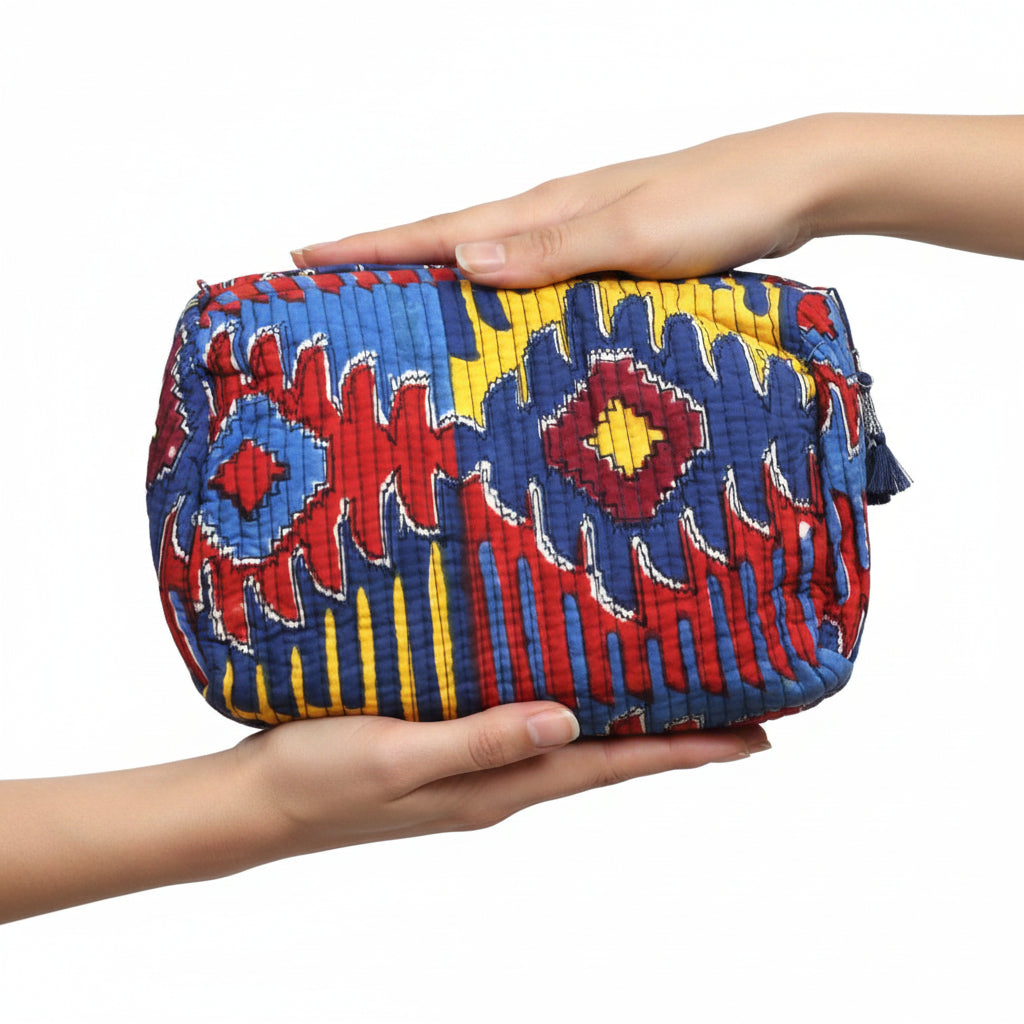 Colorful quilted pouch with geometric pattern on a white background