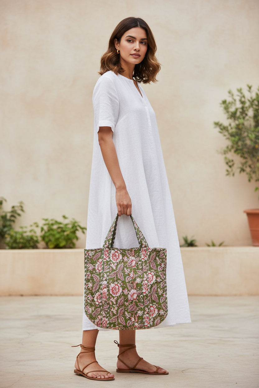 Floral patterned bag with red flowers on a green background