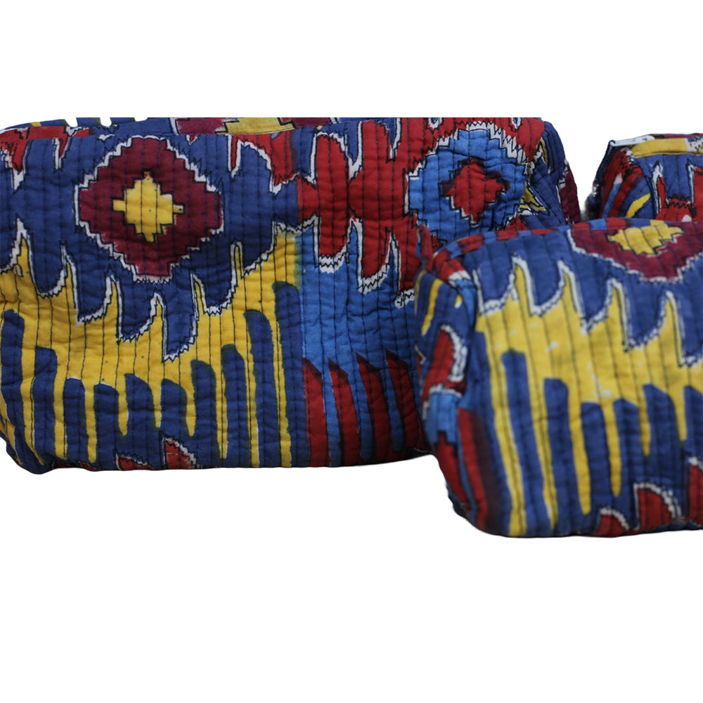Colorful patterned fabric with blue, red, and yellow colors on a white background