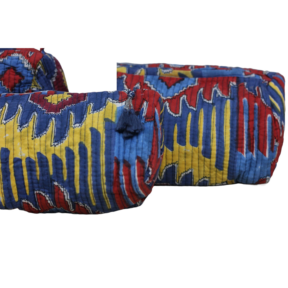 Colorful patterned fabric with blue, red, and yellow colors on a white background