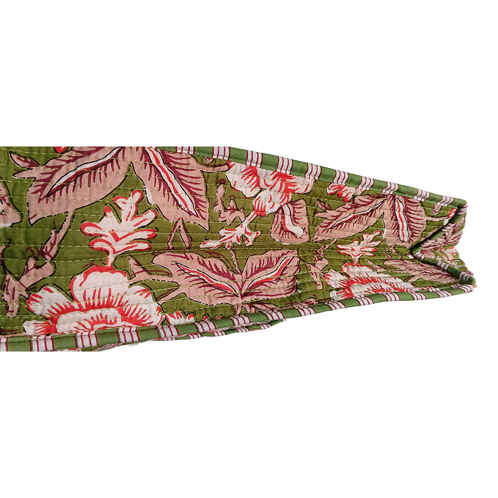 Floral headband with pink and white flowers on a green background