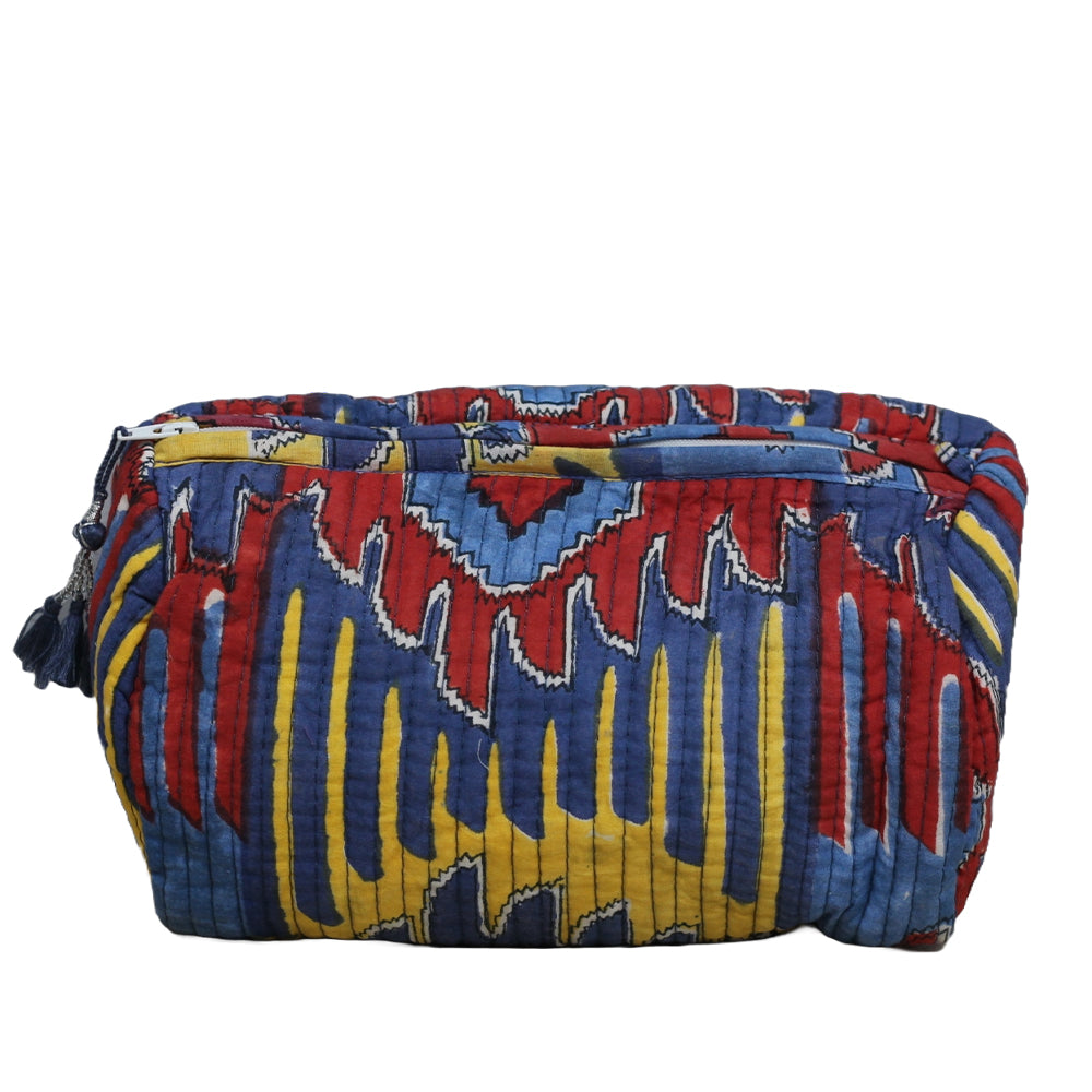 Colorful patterned bag with blue, red, and yellow design on a white background