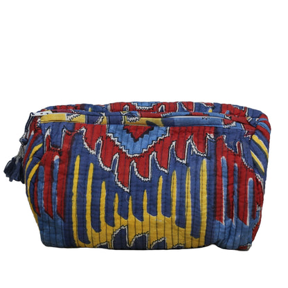 Colorful patterned bag with blue, red, and yellow design on a white background