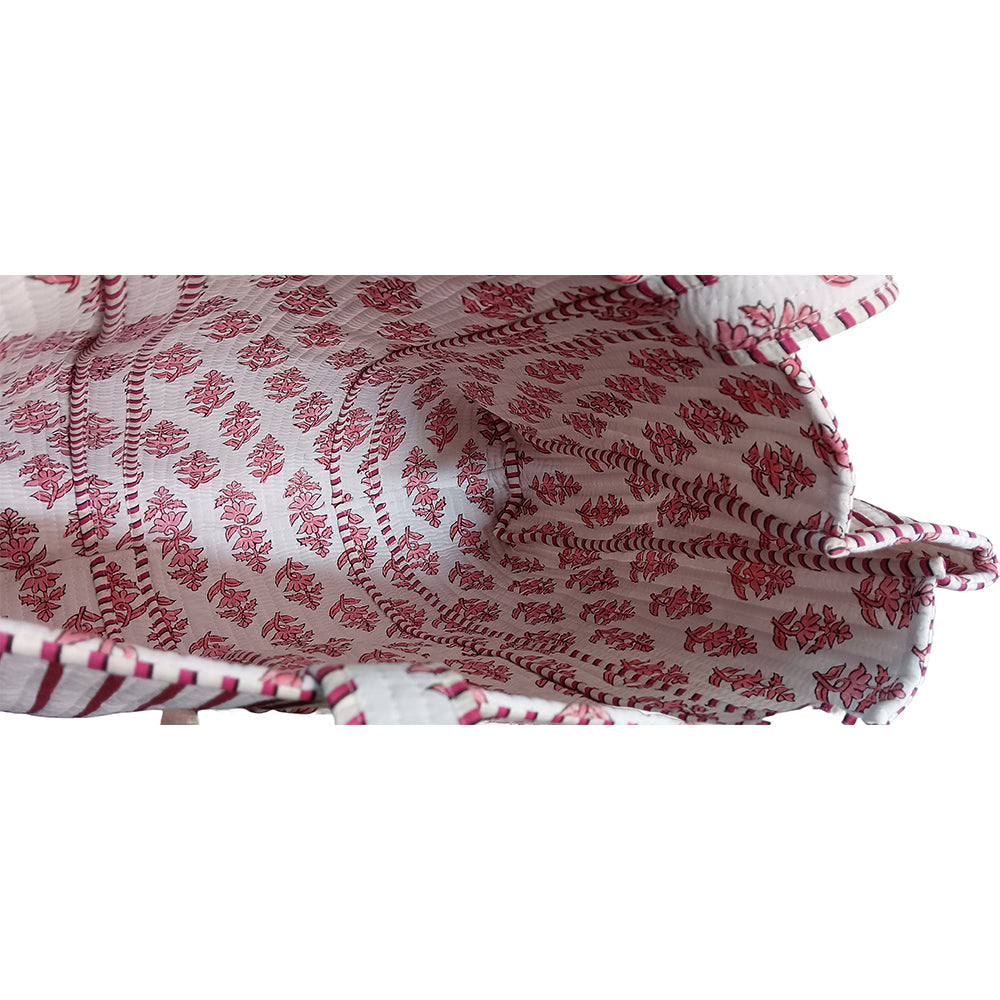 Close-up of a red and white patterned fabric with a white background