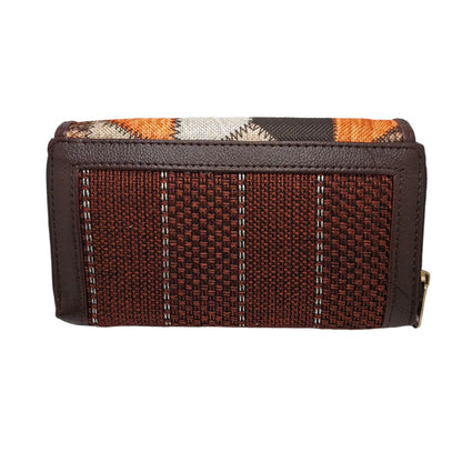 Orange brown geometric patchwork clutch - side profile showing flap and zip gusset