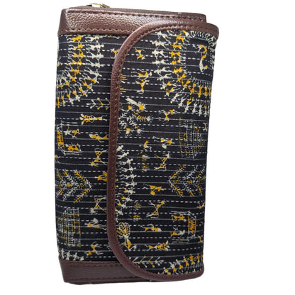 Black warli style folk art quilted clutch - side profile showing flap and zip gusset