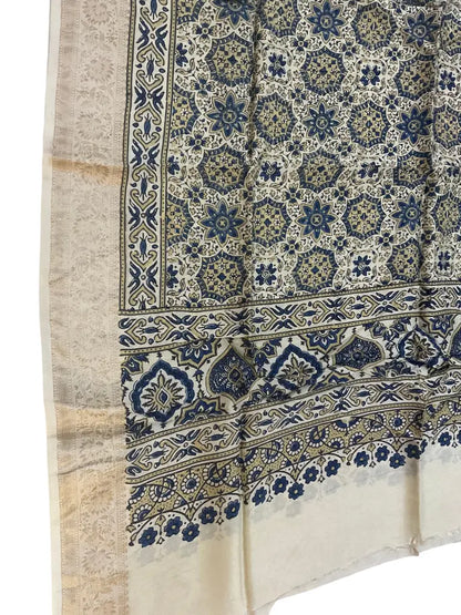 Close-up of star jaal Ajrakh hand block print and gold zari border on ivory & indigo dola silk