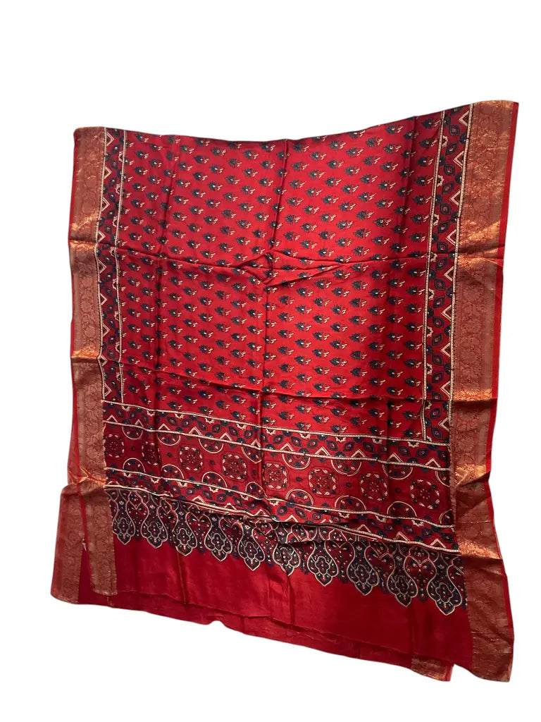 Scarlet Red hand block printed Ajrakh dupatta laid flat showing indigo buti print, pallu and zari border