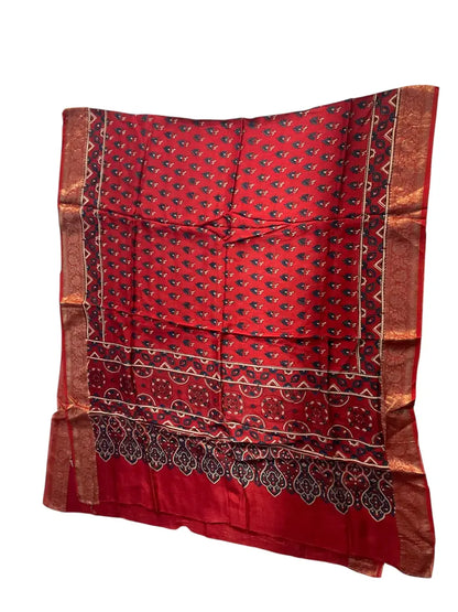 Scarlet Red hand block printed Ajrakh dupatta laid flat showing indigo buti print, pallu and zari border