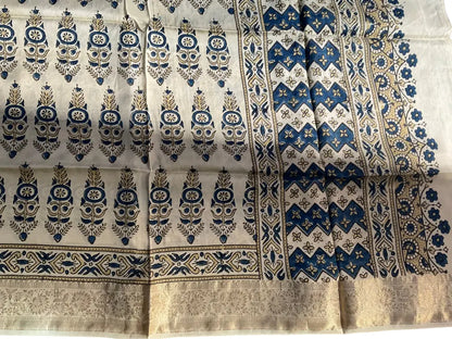 Close-up of cypress booti Ajrakh hand block print and gold zari border on cream & indigo dola silk
