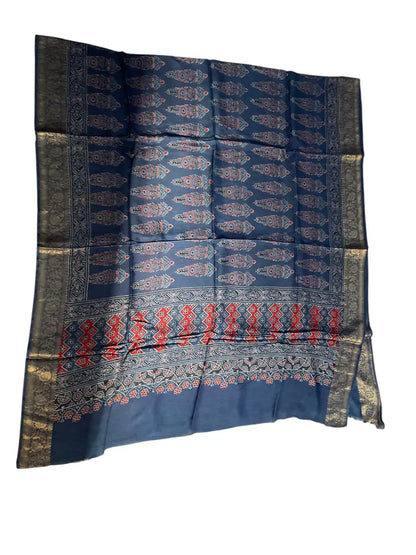 Indigo Blue & Red hand block printed Ajrakh dupatta laid flat showing cypress booti print, pallu and zari border