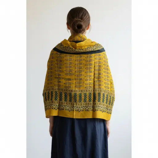 Turmeric Yellow & Teal Ajrakh dola silk dupatta with gold zari border styled over a kurta