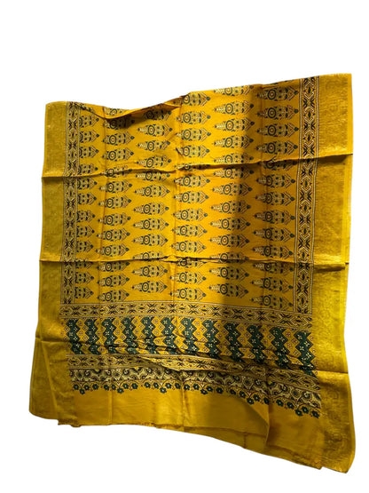 Turmeric Yellow & Teal hand block printed Ajrakh dupatta laid flat showing cypress booti print, pallu and zari border