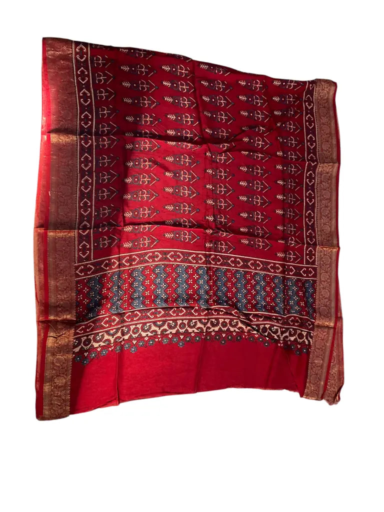 Madder Red & Indigo hand block printed Ajrakh dupatta laid flat showing cypress booti print, pallu and zari border