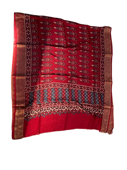 Madder Red & Indigo hand block printed Ajrakh dupatta laid flat showing cypress booti print, pallu and zari border