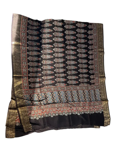 Black & Sky Blue hand block printed Ajrakh dupatta laid flat showing cypress booti print, pallu and zari border