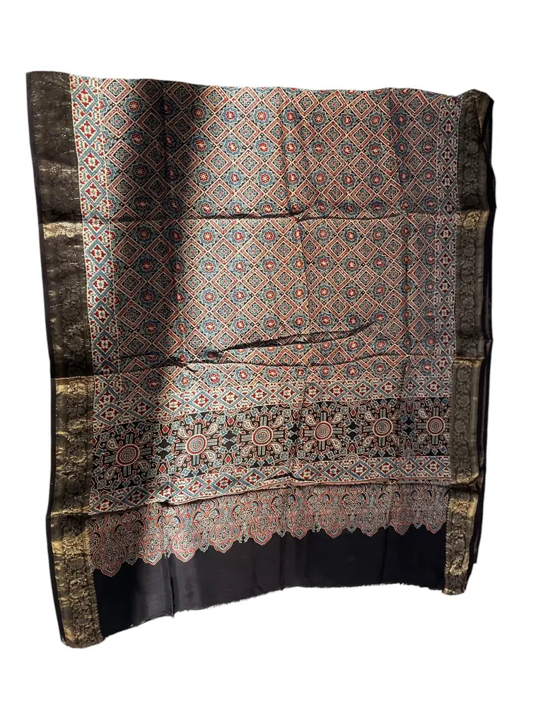 Black & Madder Red hand block printed Ajrakh dupatta laid flat showing diamond jaal print, pallu and zari border