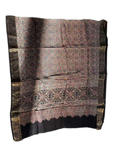 Black & Madder Red hand block printed Ajrakh dupatta laid flat showing diamond jaal print, pallu and zari border