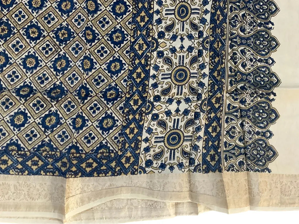 Close-up of diamond jaal Ajrakh hand block print and pale gold zari border on ivory & indigo dola silk