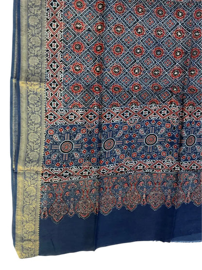 Close-up of geometric jaal Ajrakh hand block print and gold zari border on indigo & madder dola silk