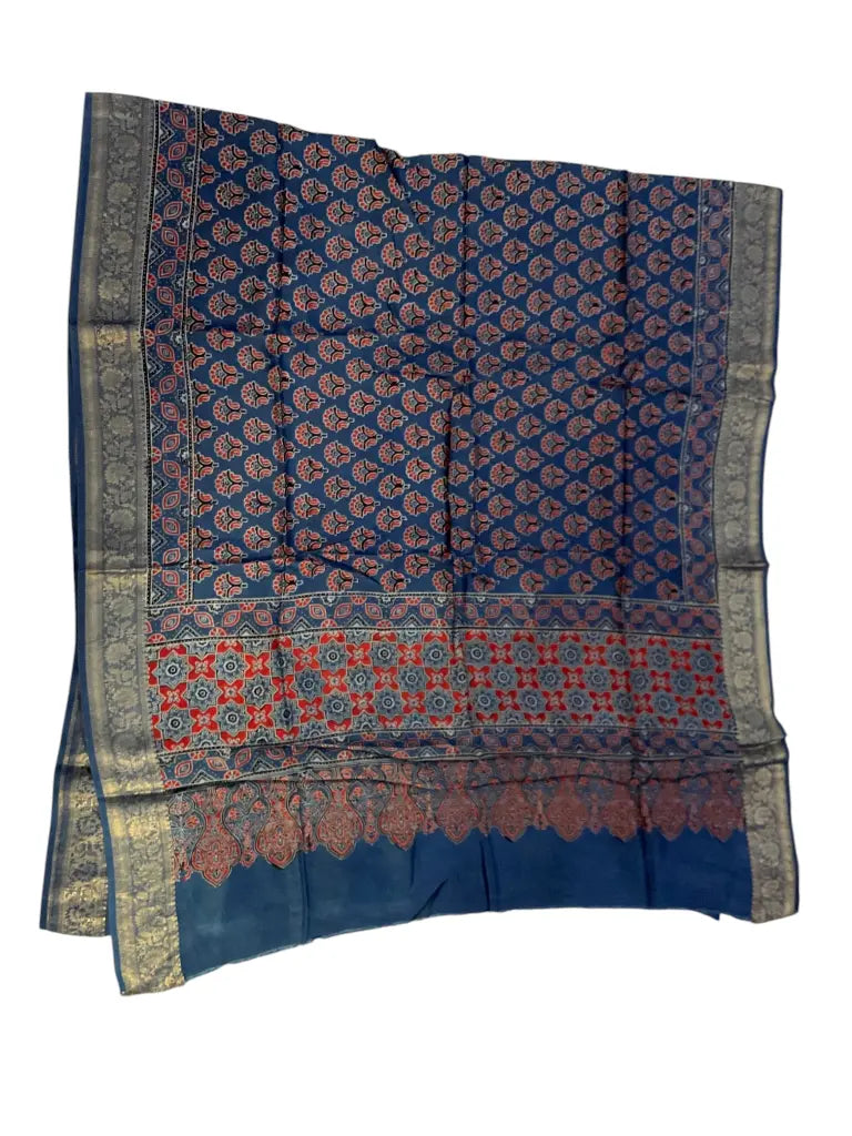 Indigo Blue hand block printed Ajrakh dupatta laid flat showing red star pallu print, pallu and zari border