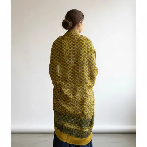 Mustard & Teal Ajrakh dola silk dupatta with gold zari border styled over a kurta
