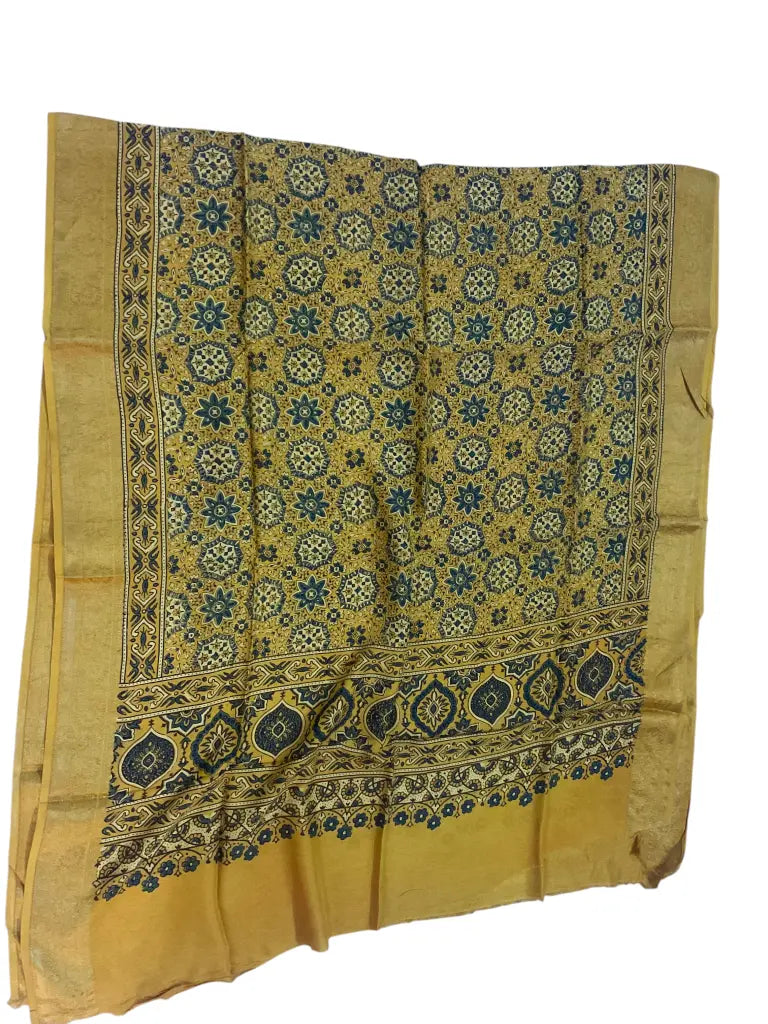 Ochre hand block printed Ajrakh dupatta laid flat showing indigo star jaal print, pallu and zari border
