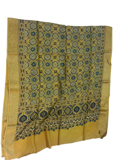 Ochre hand block printed Ajrakh dupatta laid flat showing indigo star jaal print, pallu and zari border