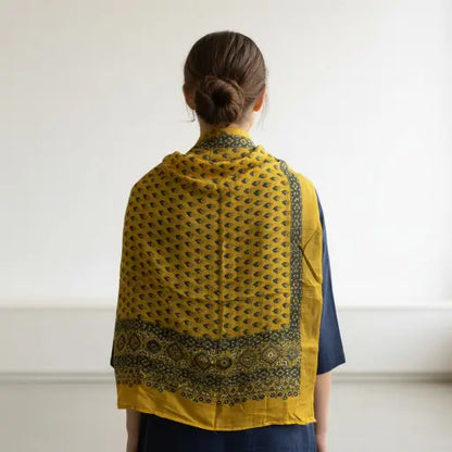 Bright Yellow & Indigo Ajrakh dola silk dupatta with yellow-gold zari border styled over a kurta