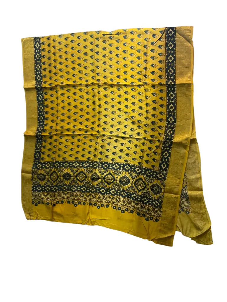 Bright Yellow & Indigo hand block printed Ajrakh dupatta laid flat showing dot buti print, pallu and zari border