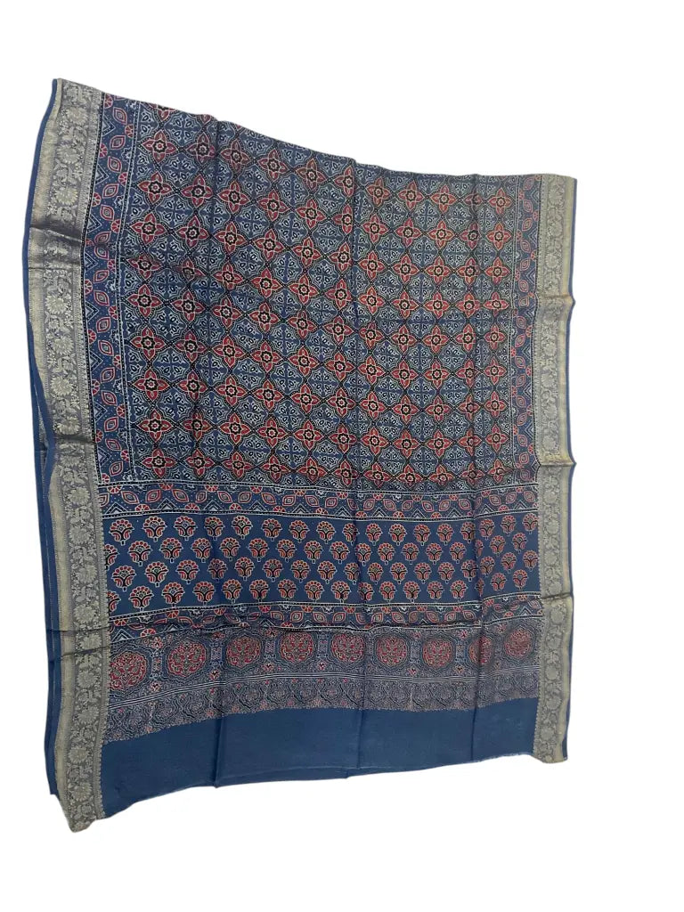 Indigo & Rust hand block printed Ajrakh dupatta laid flat showing floral buti print, pallu and zari border
