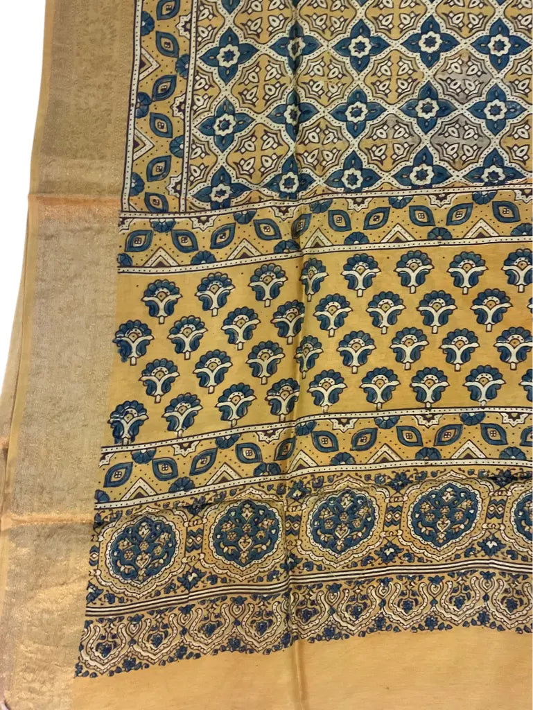 Close-up of floral diamond jaal Ajrakh hand block print and gold zari border on mustard & indigo dola silk