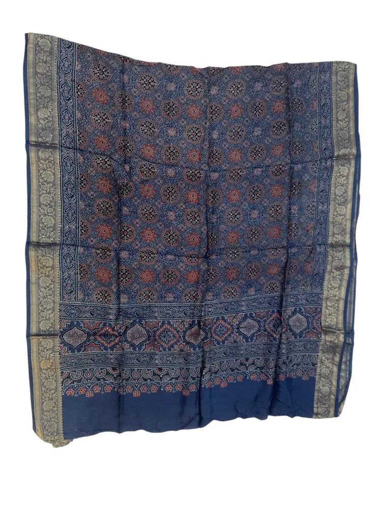 Indigo Blue & Red hand block printed Ajrakh dupatta laid flat showing star jaal print, pallu and zari border