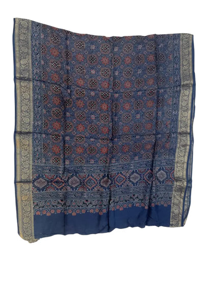 Indigo Blue & Red hand block printed Ajrakh dupatta laid flat showing star jaal print, pallu and zari border